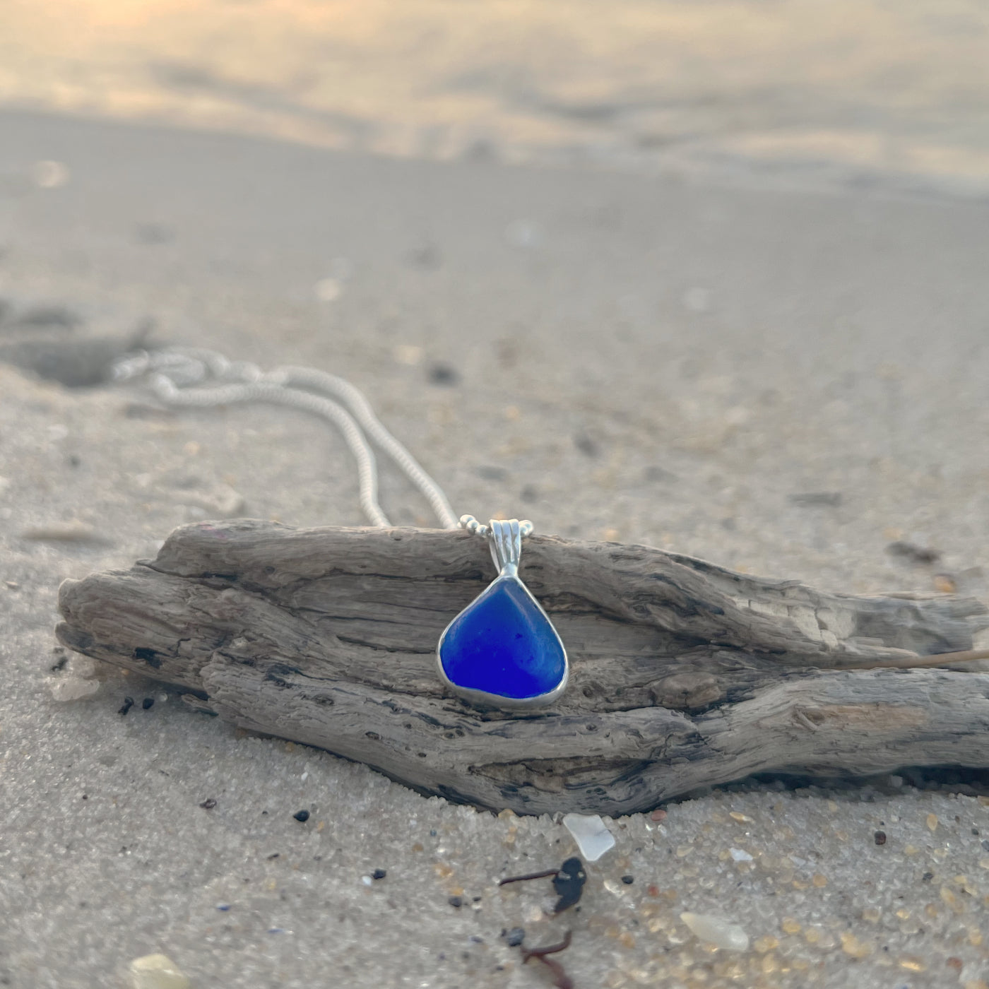 Cobalt blue sea glass set in Argentium silver to the exact shape it washed ashore. Hangs on a 40 or 45cm sterling silver chain. Pendant by Mornington Sea Glass.