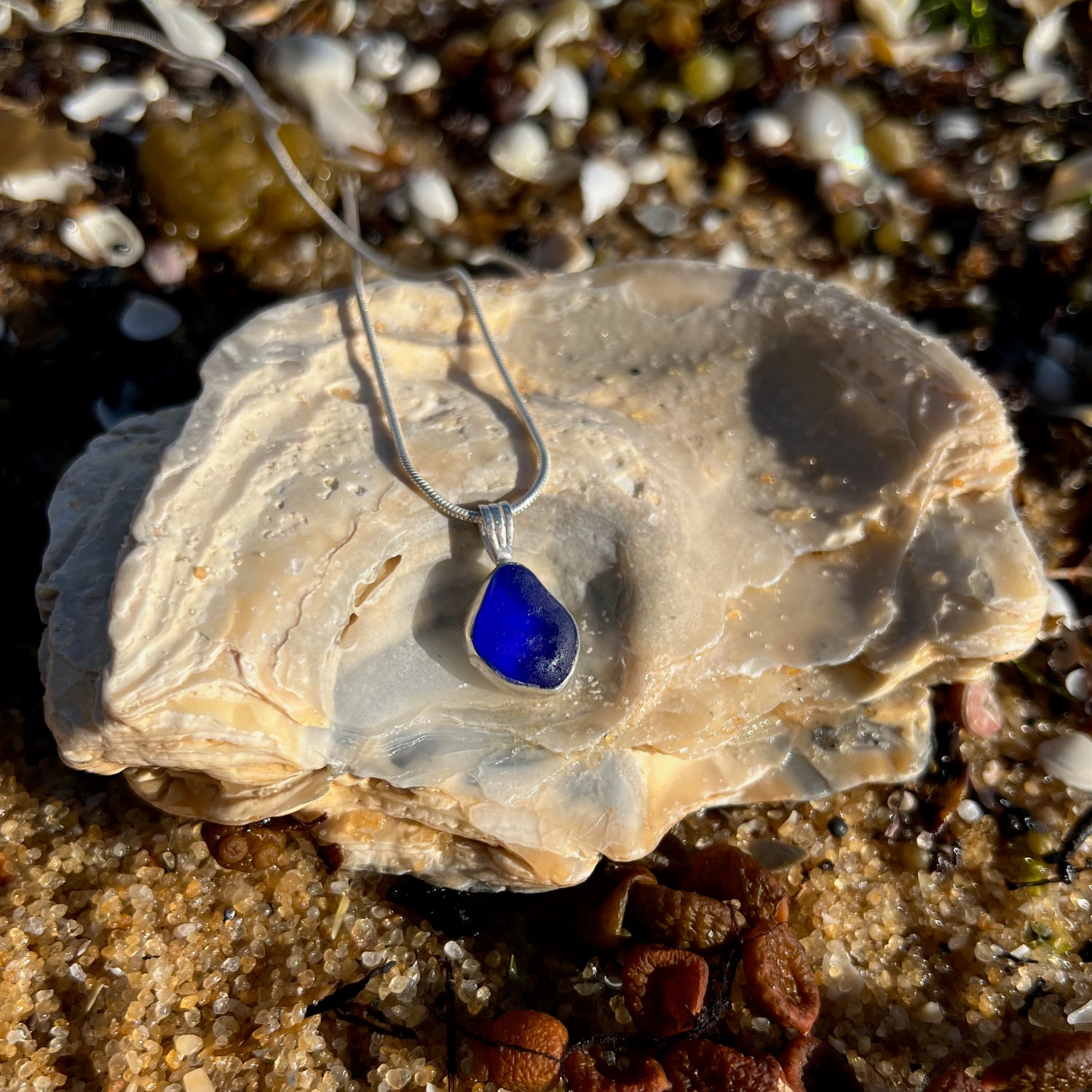 Cobalt blue sea glass set in Argentium silver to the exact shape it washed ashore. Hangs on a 40 or 45cm sterling silver chain. Pendant by Mornington Sea Glass.