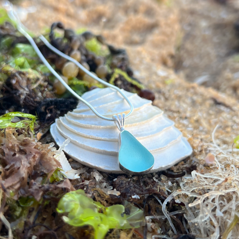 Blue sea glass set in silver pendant by Mornington Sea Glass. Hangs on a 40 or 45cm sterling silver snake chain