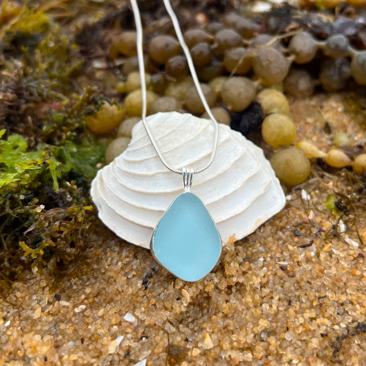 Blue sea glass set in silver pendant by Mornington Sea Glass. Cones with a 40 or 45cm sterling silver chain.