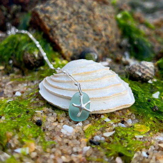 Blue  sea glass and silver sea star pendant by Mornington Sea Glass. Hangs on a 40cm +5cm ext ball detail chain.