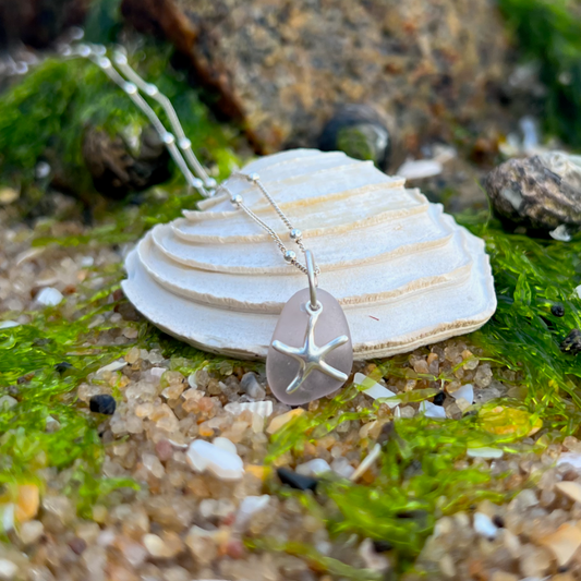 Purple sea glass and steering silver sea star necklace by Morning Sea Glass. Comes with a 40cm with 5cm ext sterling silver ball detail chain.