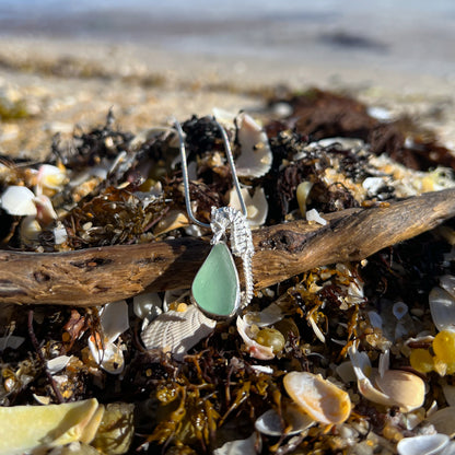 Sterling silver necklace of a small cast silver seahorse with  seafoam sea glass treasure. Hangs on a 40 or 45cm sterling silver chain. By Mornington Sea Glass.