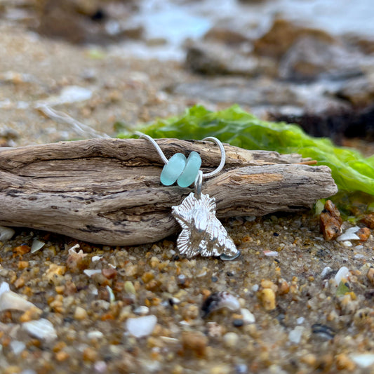 Blue sea glass and silver shell pendant necklace by Mornington Sea Glass. Hangs on a 40 or 45cm snake chain.