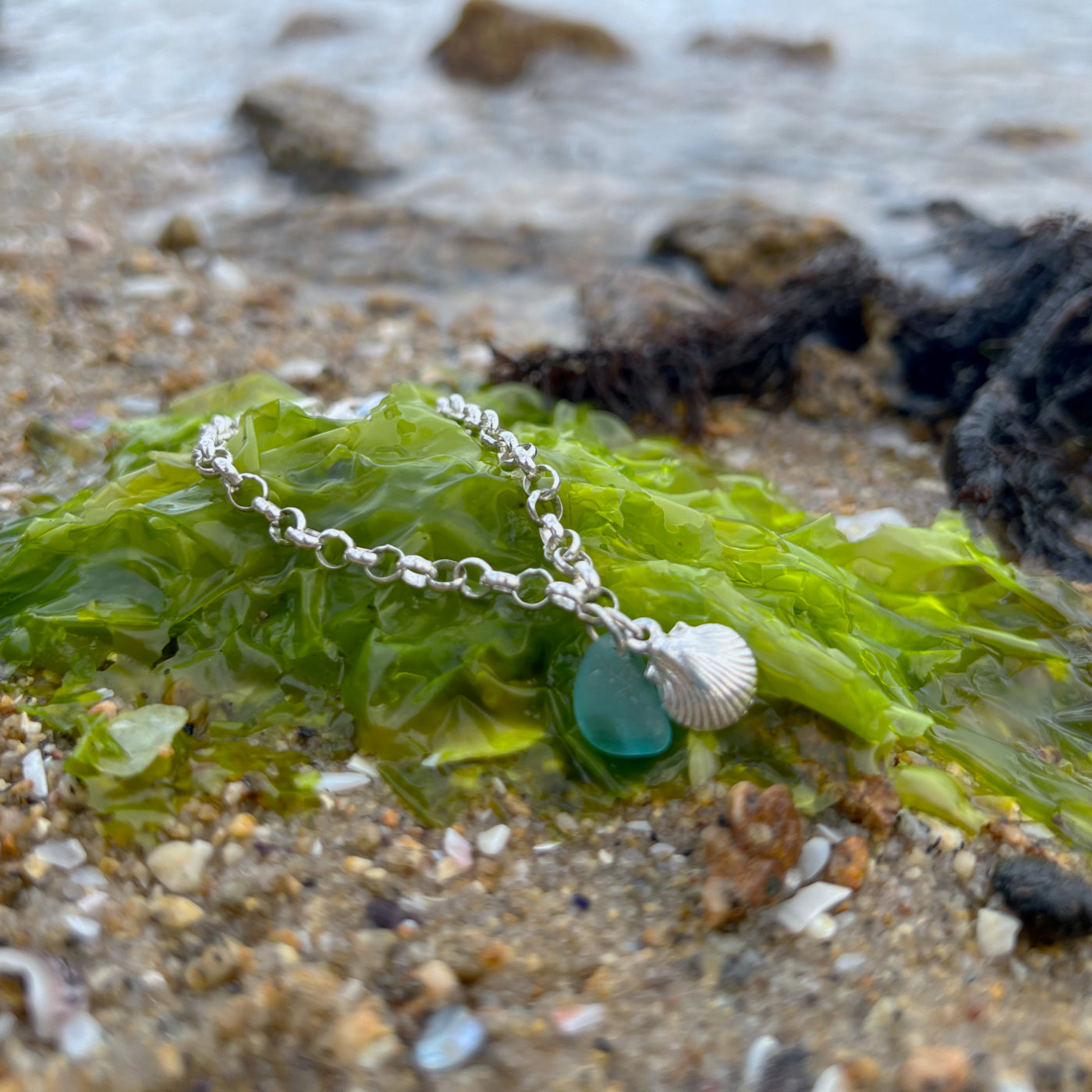 Blue sea glass and shell charm sterling silver bracelet by Mornington Sea Glass.