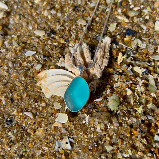 Ocean teal sea glass set in silver pendant by Mornington Sea Glass. Comes with a 40 or 45cm snake chain.
